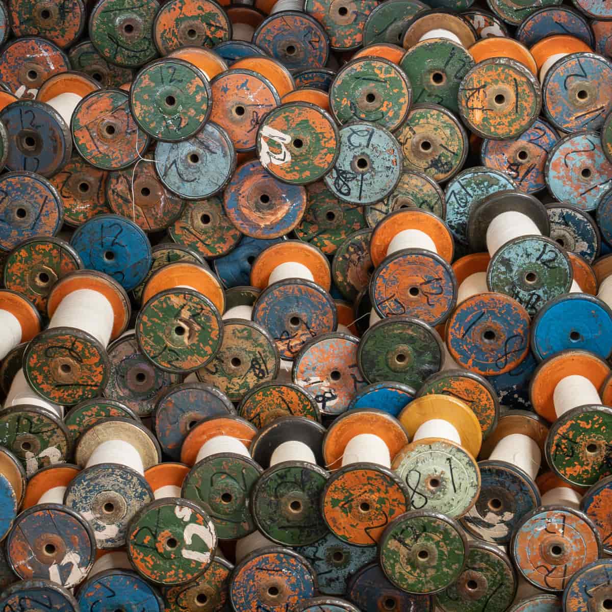 Spools of PLA filament on a workshop shelf