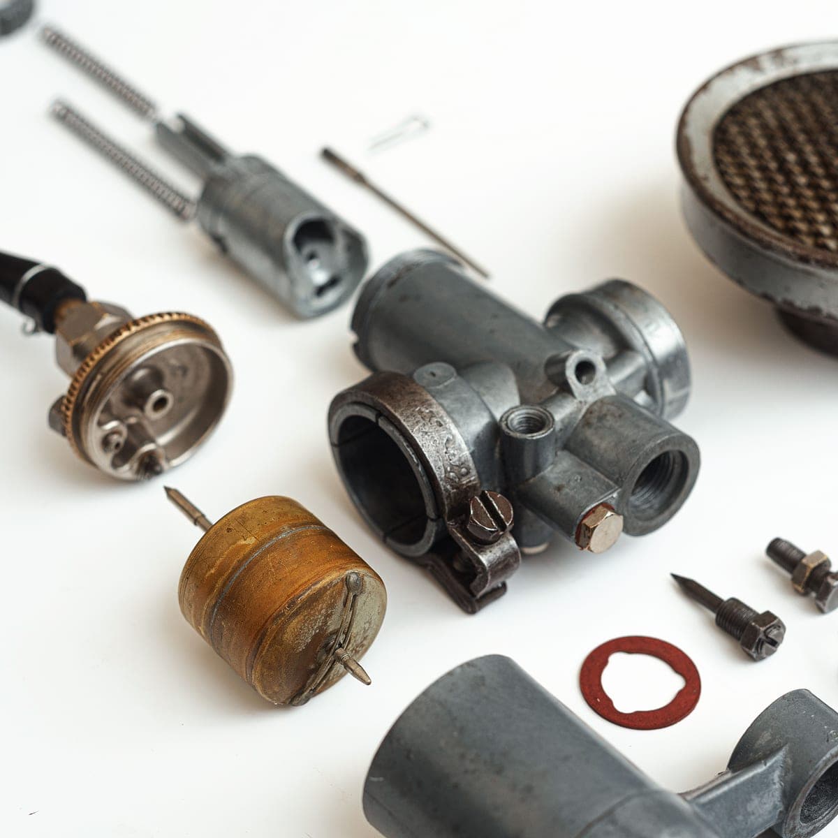 Printer spares and tools laid out on a bench