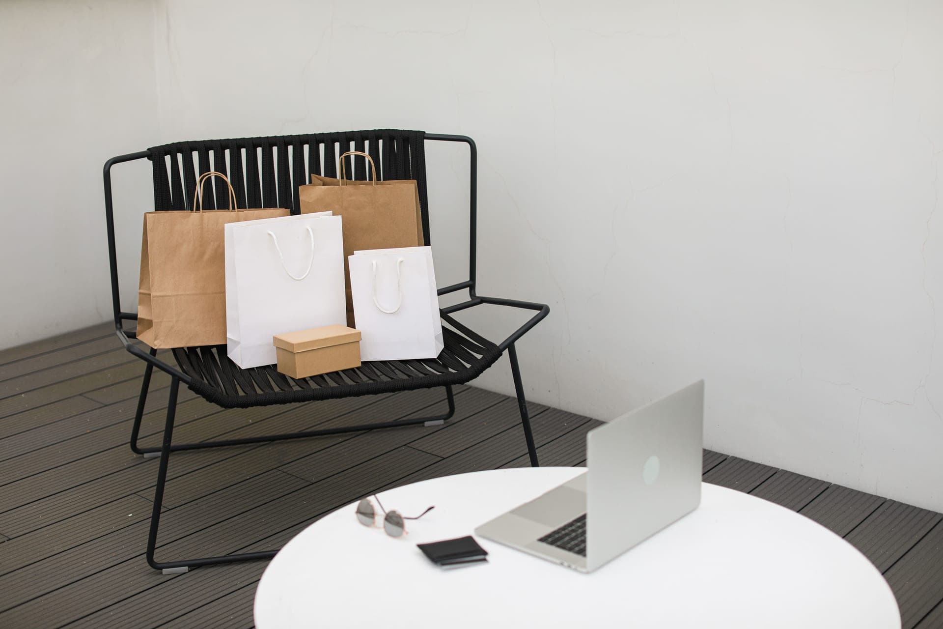 Delivered packages and a laptop on a desk